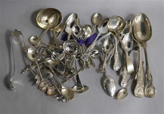 A quantity of assorted silver and plated flatware including silver sauce ladle and silver table spoons.